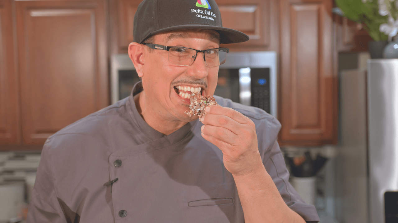 Chef Joey Galeano taking a bite of the Fabulous FECO Marshmallow Cereal Bars