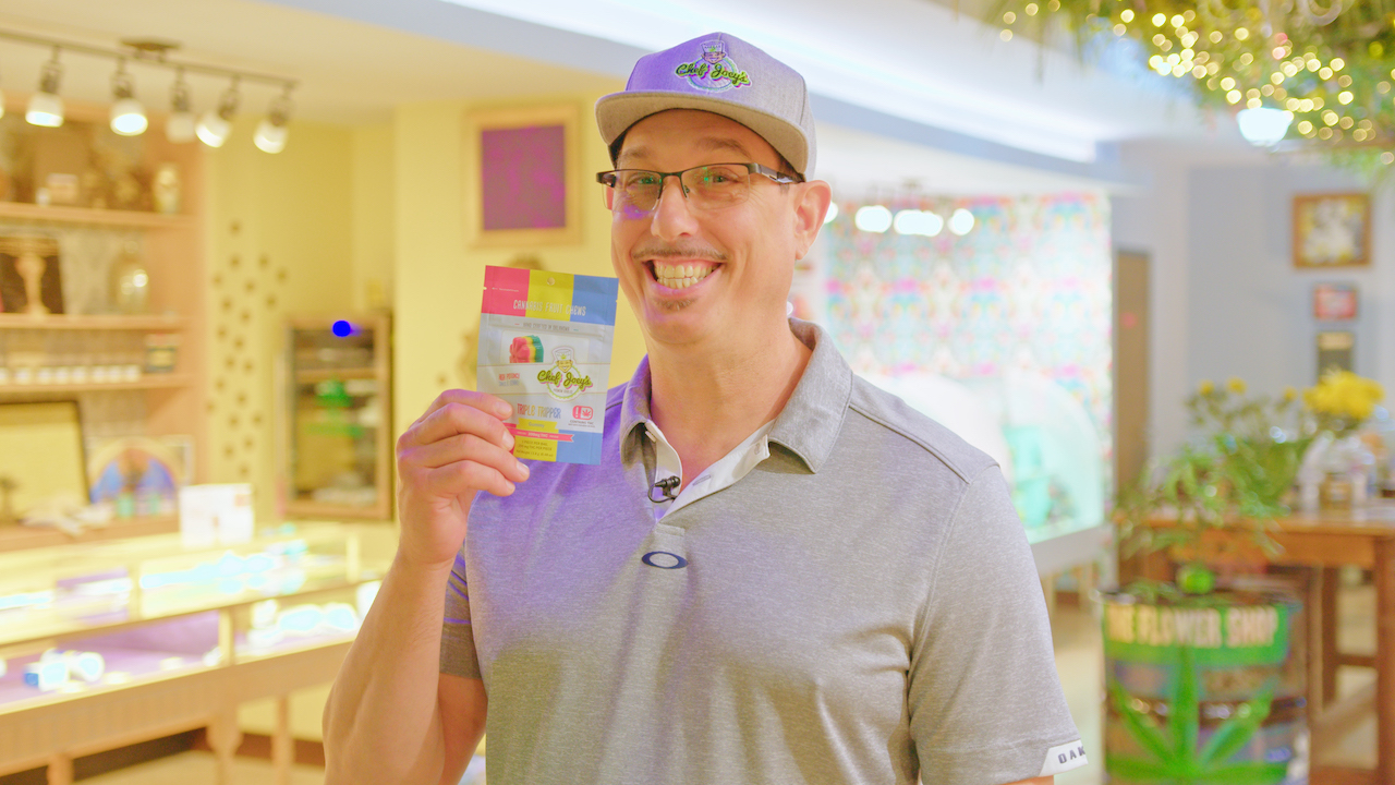 Photo of Chef Joey holding a bag of Chef Joey's gummies